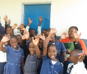 Bazaneni Primary School kids in front of an ACC-funded classroom. Bazaneni Primary School kids in front of an ACC-funded classroom.