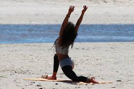gal-doing-yoga-on-beach 2